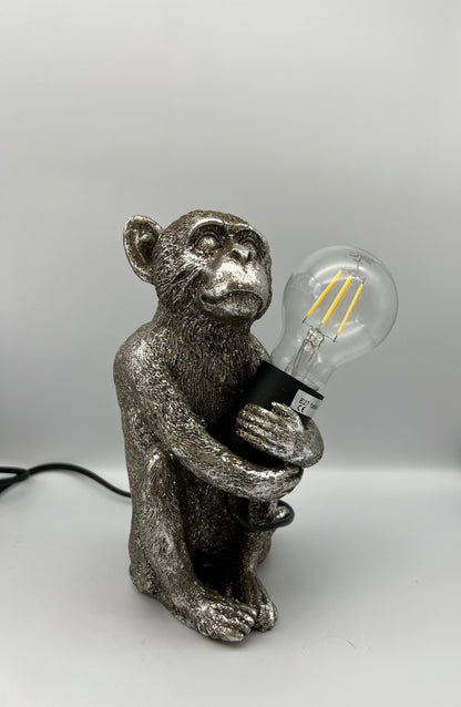 KALA - Lampe singe assis enlaçant une ampoule - B&Inside